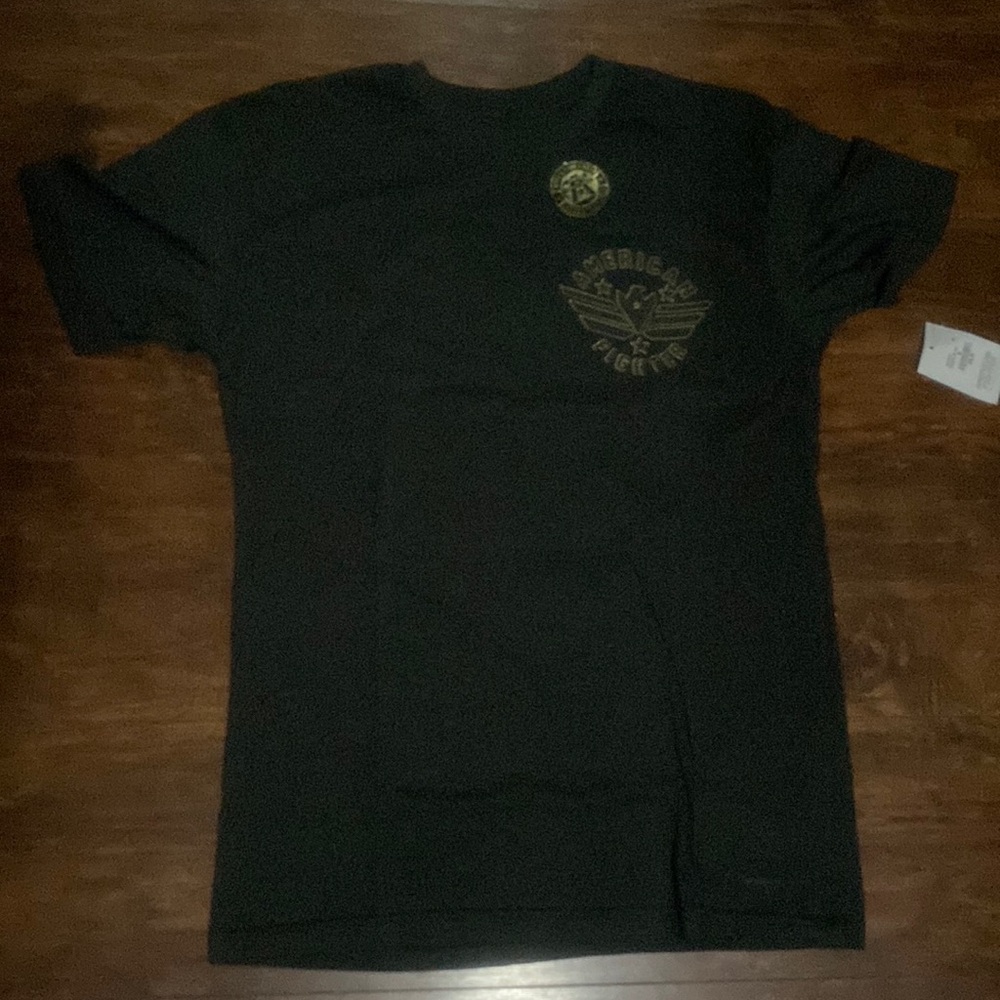 American fighter shirt brand new with tag. Size medium. Dark green gold letters
